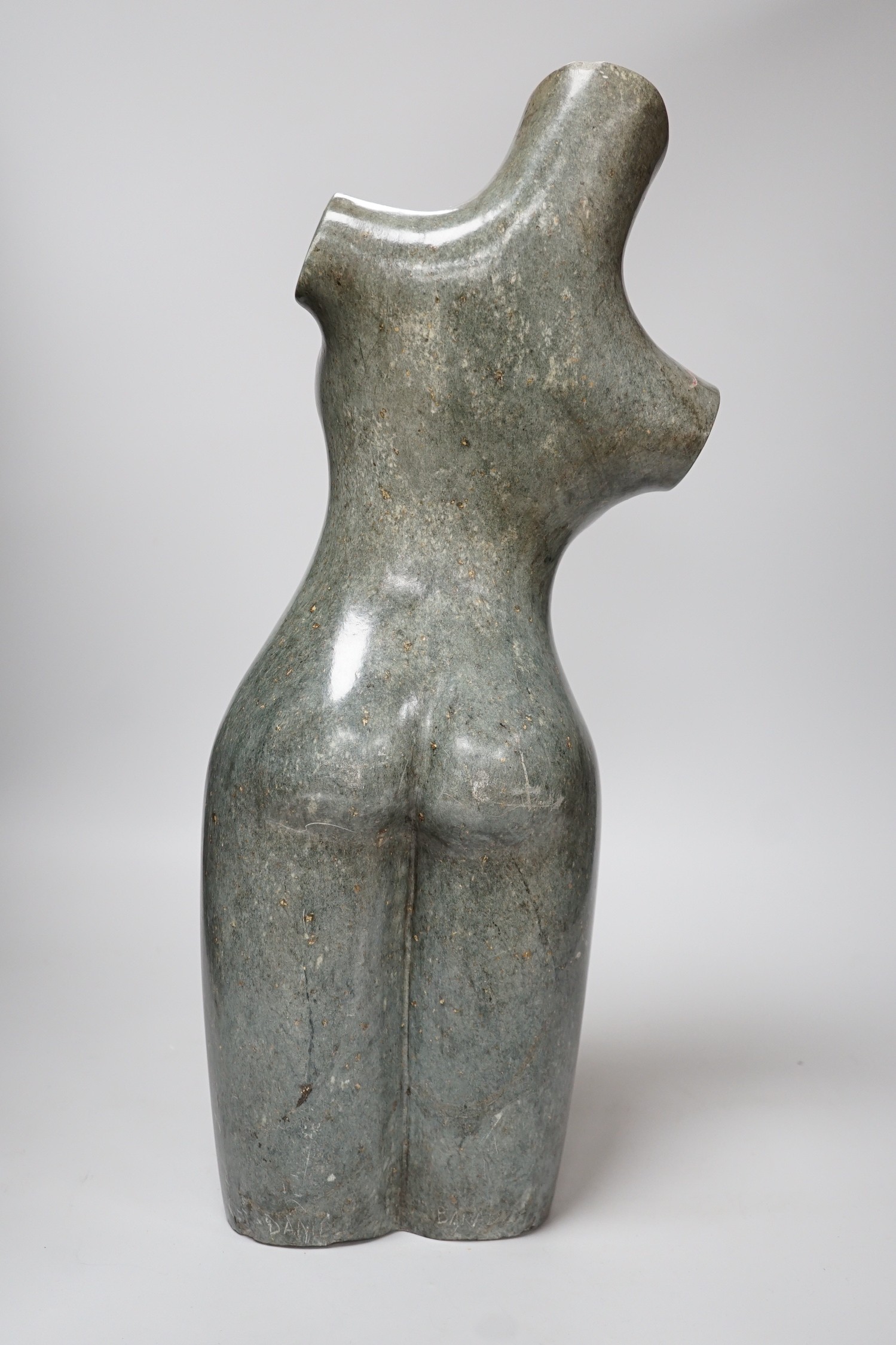 Daniel Baradza (Zimbabwean). A large carved stone female torso, 52cms high